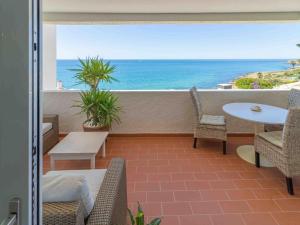 a balcony with a view of the ocean at Bliss Luz Horizon - Panoramic Sea View - 50m to Beach - Central Praia da Luz - Walk distance to Everywhere in Luz +18 photos