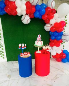 a red white and blue birthday party with a cake and balloons at Villa DMM con piscina, jacuzzi y gran área verde en Punta Cana in Punta Cana