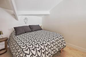 En eller flere senge i et værelse på La Galerie Pornic - Maison Cedre + 13 billeder