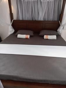 Postel nebo postele na pokoji v ubytování MANJU Homestay Unawatuna