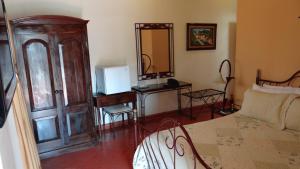 Кровать или кровати в номере Hotel Plaza Copan