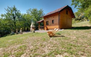 a wooden cabin with a bench in front of it at Luxury Love Cottage Spa- privatni jacuzzi &sauna , mir i privatnost in Velika Gorica