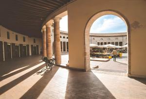 an open hallway with an archway in a building at Casa Adelaide in Senigallia