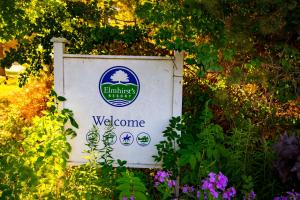 a welcome sign in the middle of some flowers at Elmhirst's Resort in Keene