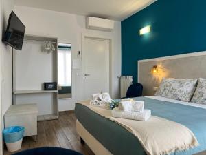 A bed or beds in a room at Porta alla Croce Guest House