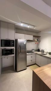 Η κουζίνα ή μικρή κουζίνα στο Flat in Sapucaia do Sul +5 φωτογραφίες