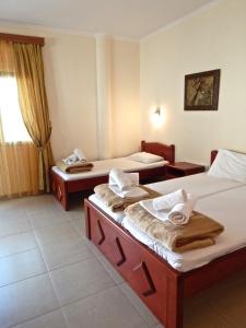 A bed or beds in a room at Panorama Apartments and Studios