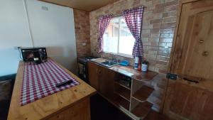 Kuchyň nebo kuchyňský kout v ubytování Departamento familiar