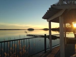 a view of a lake at sunset from a porch at Elmhirst's Resort in Keene