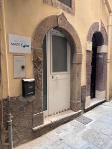 a door on the side of a building with arches at MareLuna in Gaeta
