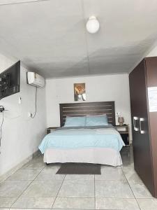 Postel nebo postele na pokoji v ubytování Exodus Guesthouse
