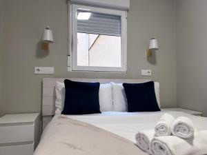 Ένα ή περισσότερα κρεβάτια σε δωμάτιο στο Plaza España Centro - Apartamento para 8 personas