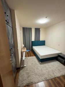 Giường trong phòng chung tại JMN Pamporovo