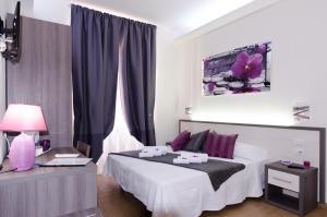 Postel nebo postele na pokoji v ubytování Gemme Di Roma Accomodation
