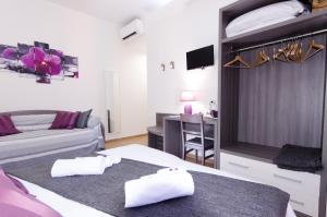 Postel nebo postele na pokoji v ubytování Gemme Di Roma Accomodation