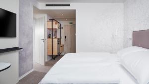 OREA Resort Santon Brno客房内的一张或多张床位