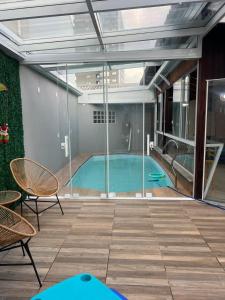 Bazén v ubytování Casa 3 quartos com Piscina no centro de Penha - SC nebo v jeho okolí + 38 fotografií