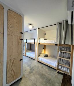 Postel nebo postele na pokoji v ubytování HOM Hostel Boutique