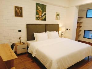 Ένα ή περισσότερα κρεβάτια σε δωμάτιο στο Hotel Provenza Garden +42 φωτογραφίες