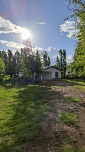 a house in the middle of a grass field at Departamento Parras del Abuelo 2 in Malargüe