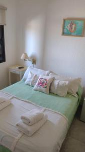 Una cama o camas en una habitación de Hotel Barracuda