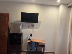 TV a/nebo společenská místnost v ubytování Hostal Venecia + 7 fotografií