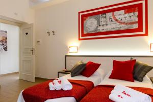 Postel nebo postele na pokoji v ubytování Gemme Di Roma Accomodation