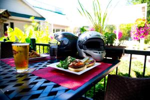 a table with a plate of food and a helmet at Elmhirst's Resort in Keene