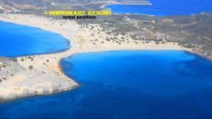 an aerial view of a beach with blue water at Simosmare Resort in Elafonisos