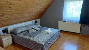 Posteľ alebo postele v izbe v ubytovaní Aranykagyló Nyaralóház