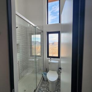 a bathroom with a toilet and a glass shower at Altitude Adjustment in Nellysford +48 photos