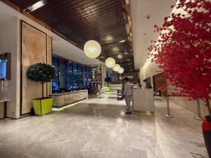 a person standing in the lobby of a building at The Suites At Platinum KLCC in Kuala Lumpur +81 photos