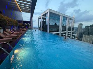 a large swimming pool on top of a building at The Suites At Platinum KLCC in Kuala Lumpur