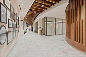 a hallway of a building with pictures on the walls at Spokane Tribe Resort and Casino in Airway Heights