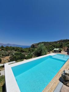 a large swimming pool with blue water at Amos Sea View in Marmaris