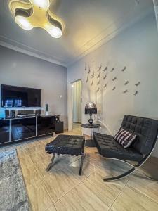 TV a/nebo společenská místnost v ubytování Estrela Comfortable Home + 29 fotografií
