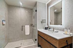 a bathroom with a sink and a shower at Spokane Tribe Resort and Casino in Airway Heights