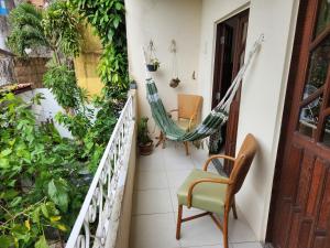 a hammock on the balcony of a house at Apto Charmoso Santo Antônio in Salvador