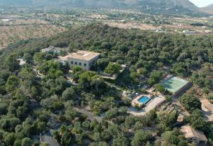 an aerial view of a large house with a pool at Hotel Llenaire in Port de Pollensa