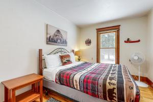 a bedroom with a bed and a window at Columbia Falls Ranch Living in Columbia Falls