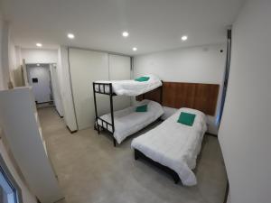 Ένα ή περισσότερα κρεβάτια σε δωμάτιο στο La Casa de los Keikis