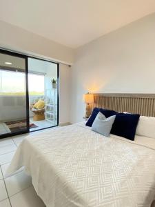 Ένα ή περισσότερα κρεβάτια σε δωμάτιο στο Acogedor Apartmento en Bahia del Morro I