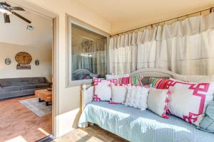 a bedroom with a bed with pillows and a mirror at half Mi to Lake Lawtonka Mtn-View Haven! in Medicine Park