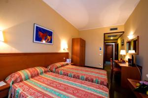 Postel nebo postele na pokoji v ubytování TH Cinisi - Florio Park Hotel