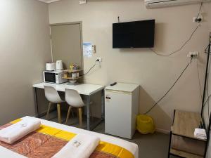 TV a/nebo společenská místnost v ubytování Kalua Motel