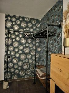 a room with a wall full of plates on a wall at Ferienwohnung AM HOCHBERG in Bad Kissingen +23 photos