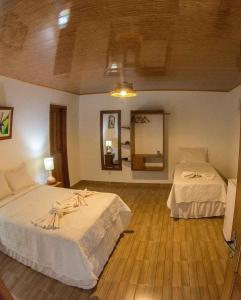 Voodi või voodid majutusasutuse Evolução Ecolodge toas