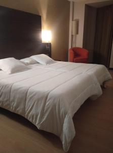 Postel nebo postele na pokoji v ubytování Hotel Juleca