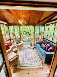 a living room with a blue couch in a house at The Limehouse Cottage in Killybegs