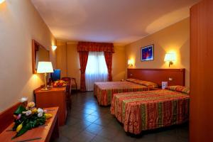 Postel nebo postele na pokoji v ubytování TH Cinisi - Florio Park Hotel
